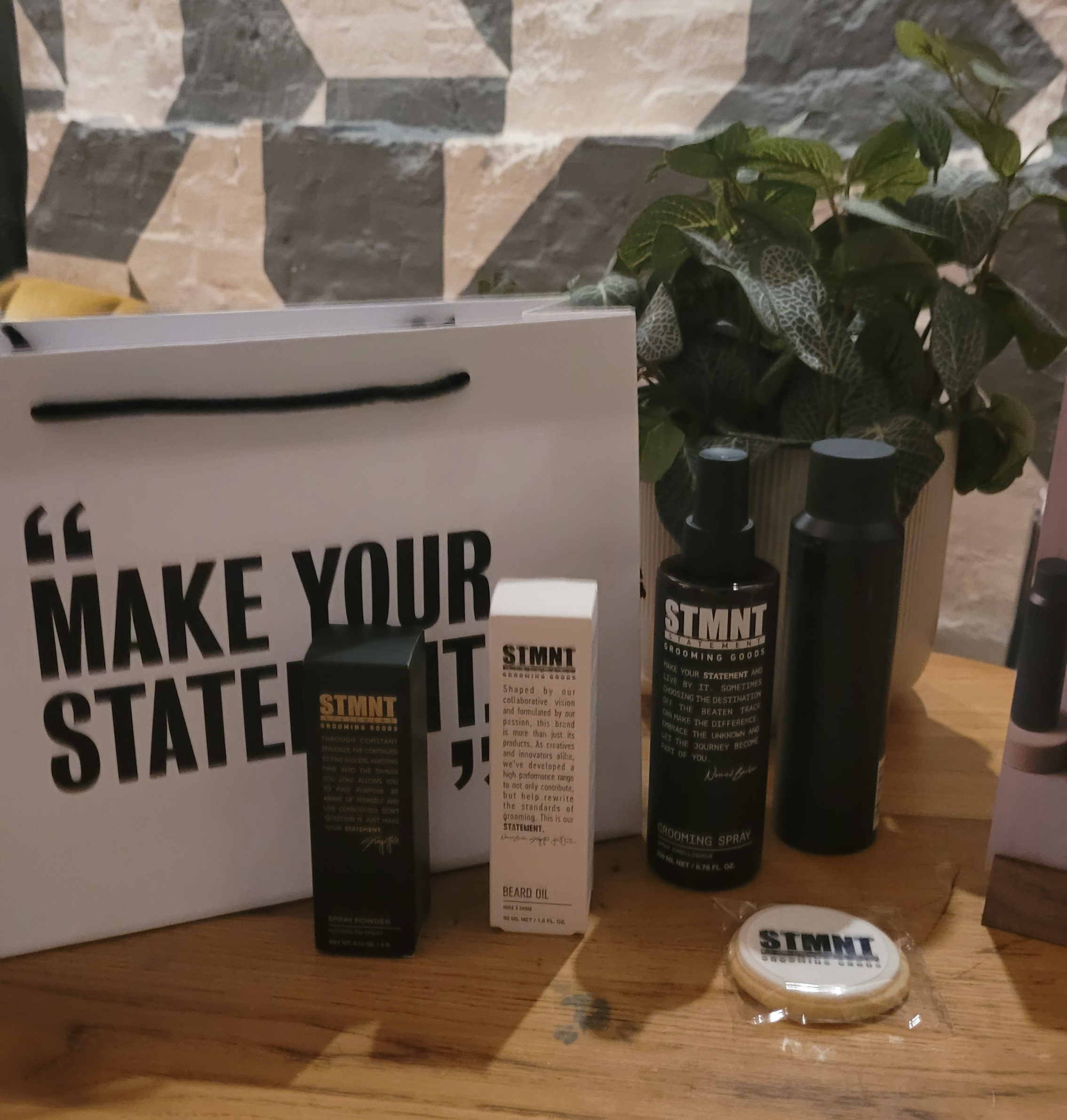 STMNT range products on a wooden table