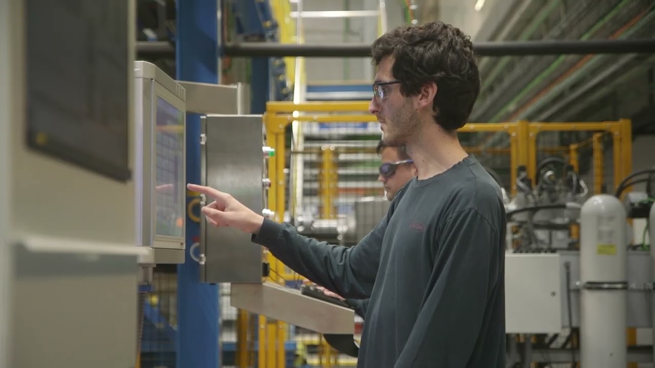 YouTube Thumbnail Interior of the aerospace plant with staff working (Thumbnail)