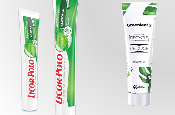 Recyclable toothpaste tubes lined up next to each other.
