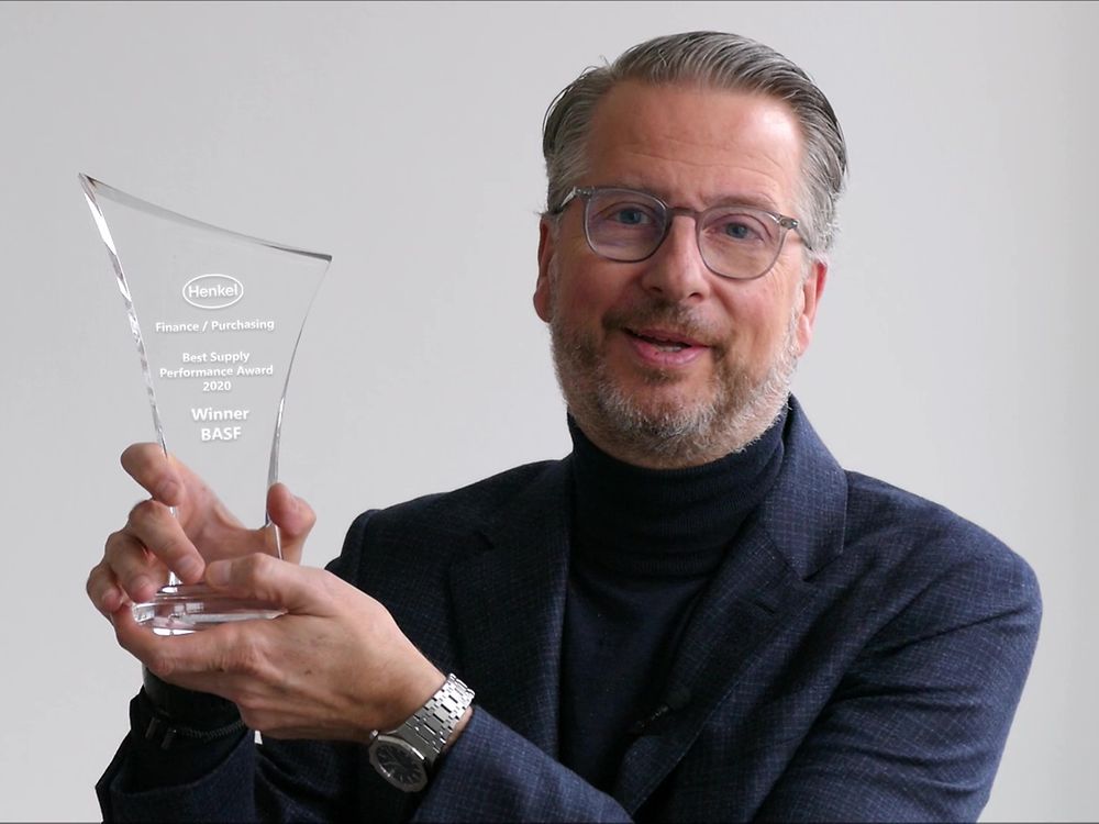 Ralph Schweens holding an award