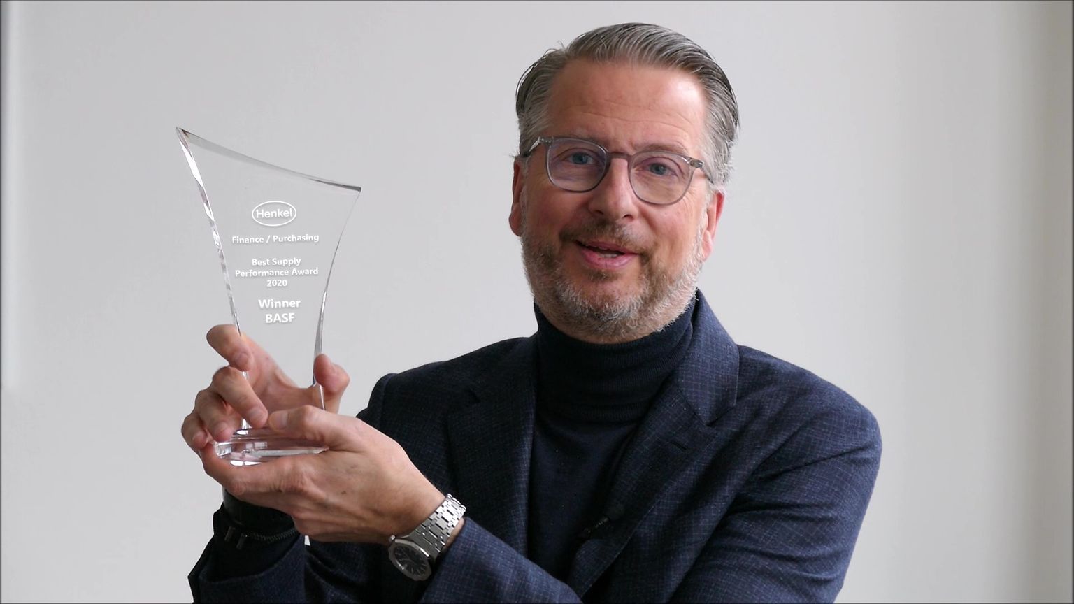 Ralph Schweens holding an award