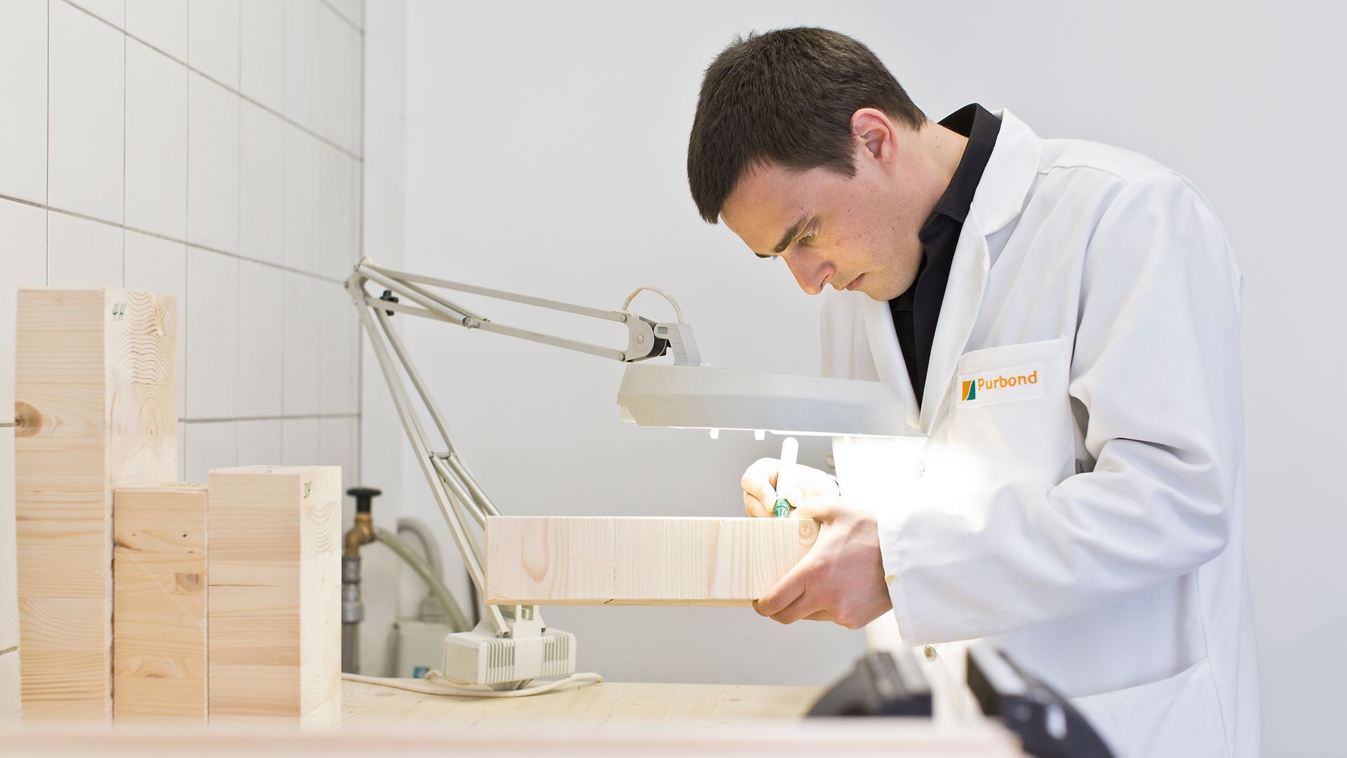Employee working with mass timber