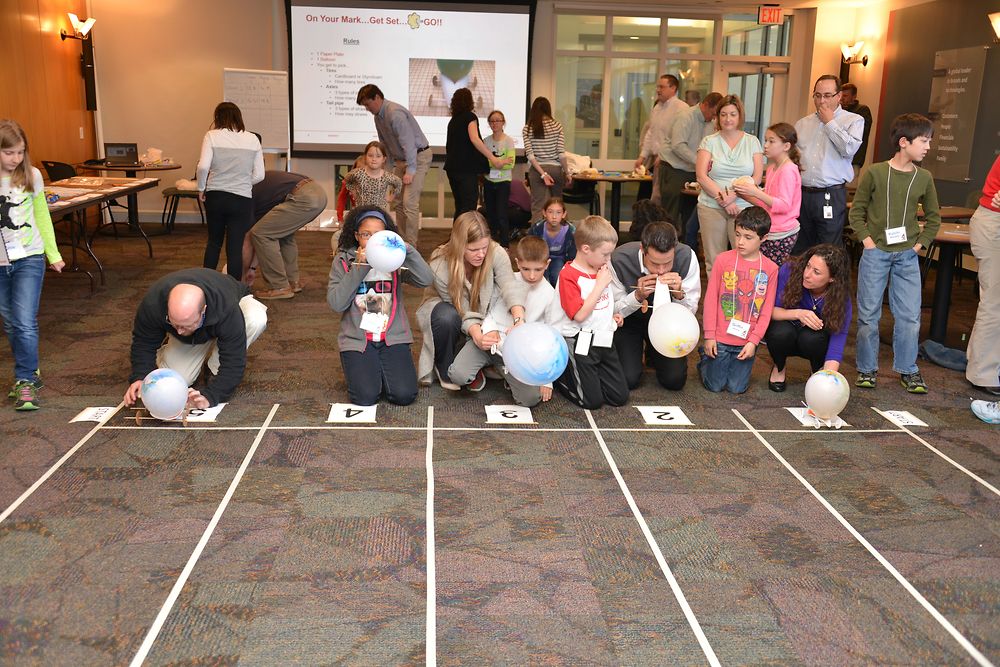 Kids and their parents raced their balloon-powered cars in the cafeteria to cap off the day.
