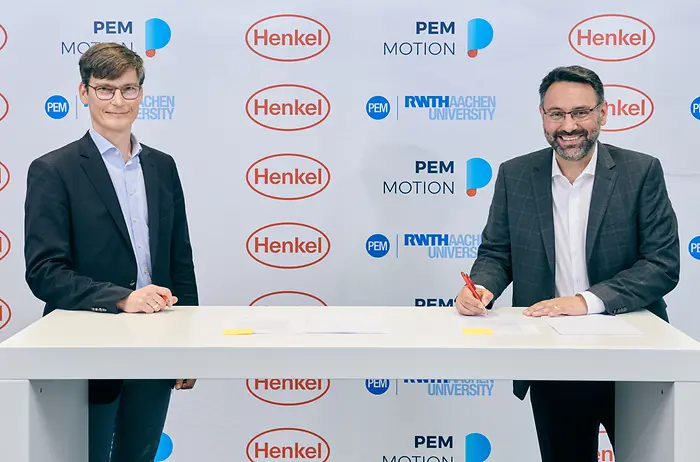 Professor Achim Kampker, Chair Holder and Partner at PEM (left), and George Kazantzis, Corporate Vice President Adhesive Technologies, Automotive Components, Henkel (right)