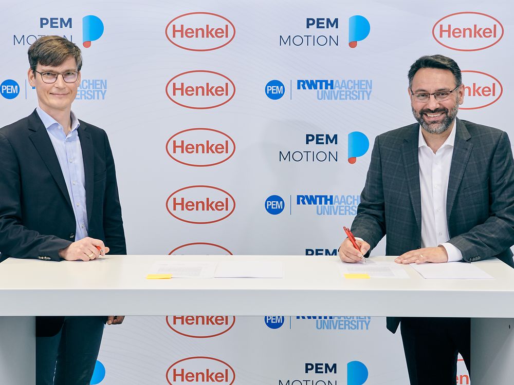 Professor Achim Kampker, Chair Holder and Partner at PEM (left), and George Kazantzis, Corporate Vice President Adhesive Technologies, Automotive Components, Henkel (right)