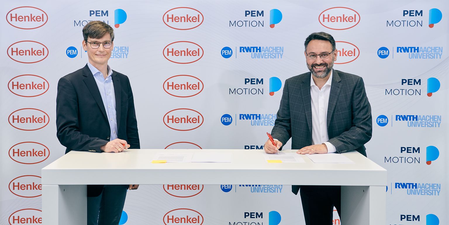 Professor Achim Kampker, Chair Holder and Partner at PEM (left), and George Kazantzis, Corporate Vice President Adhesive Technologies, Automotive Components, Henkel (right)