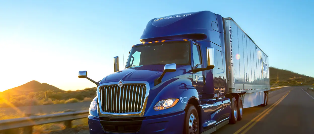photos of various trucks and drivers smiling inside truck cab