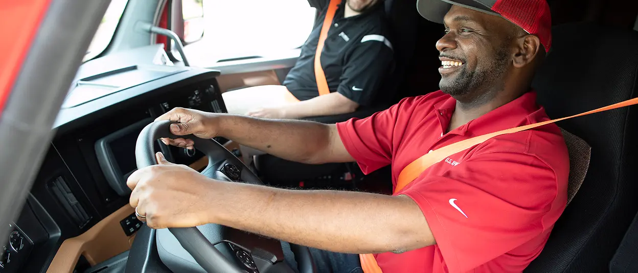 photos of various trucks and drivers smiling inside truck cab