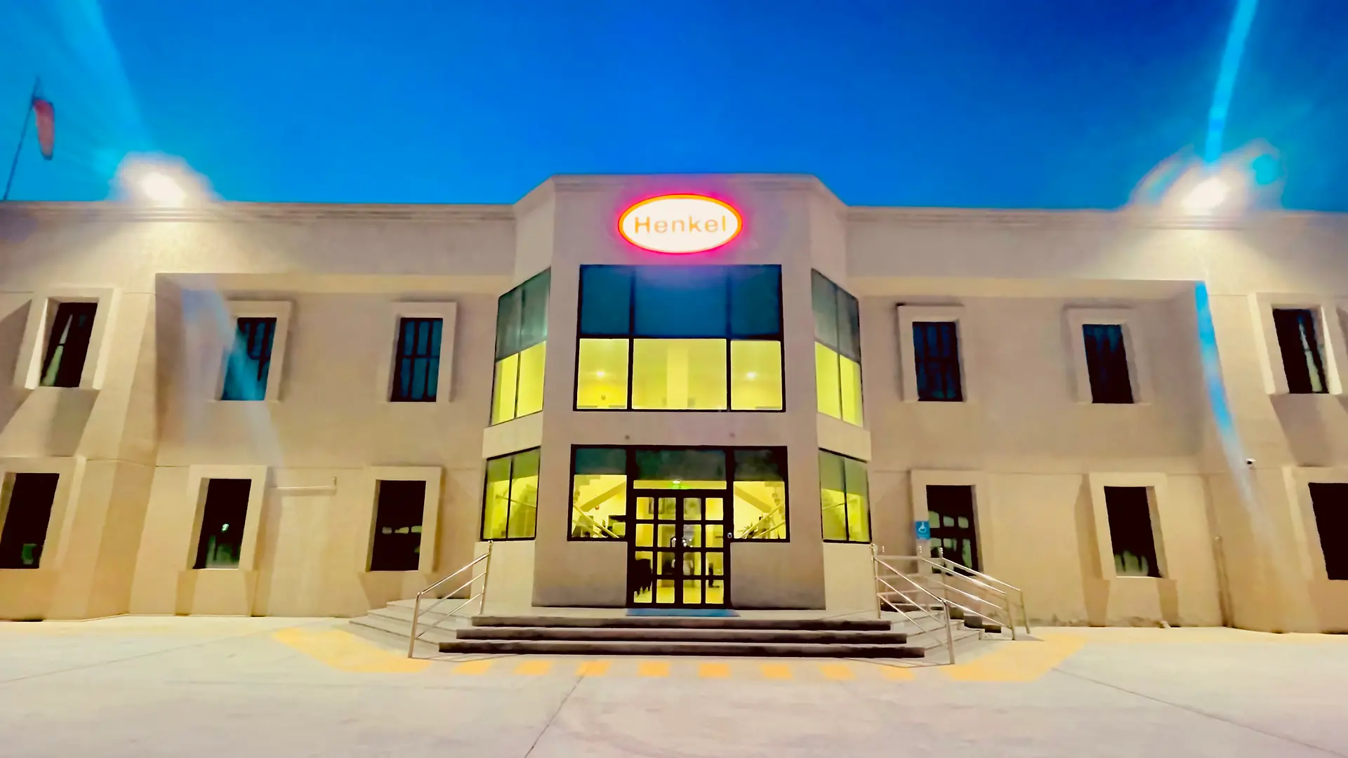 Front side of the Henkel building in Dammam with a bright Henkel logo in the middle of it.