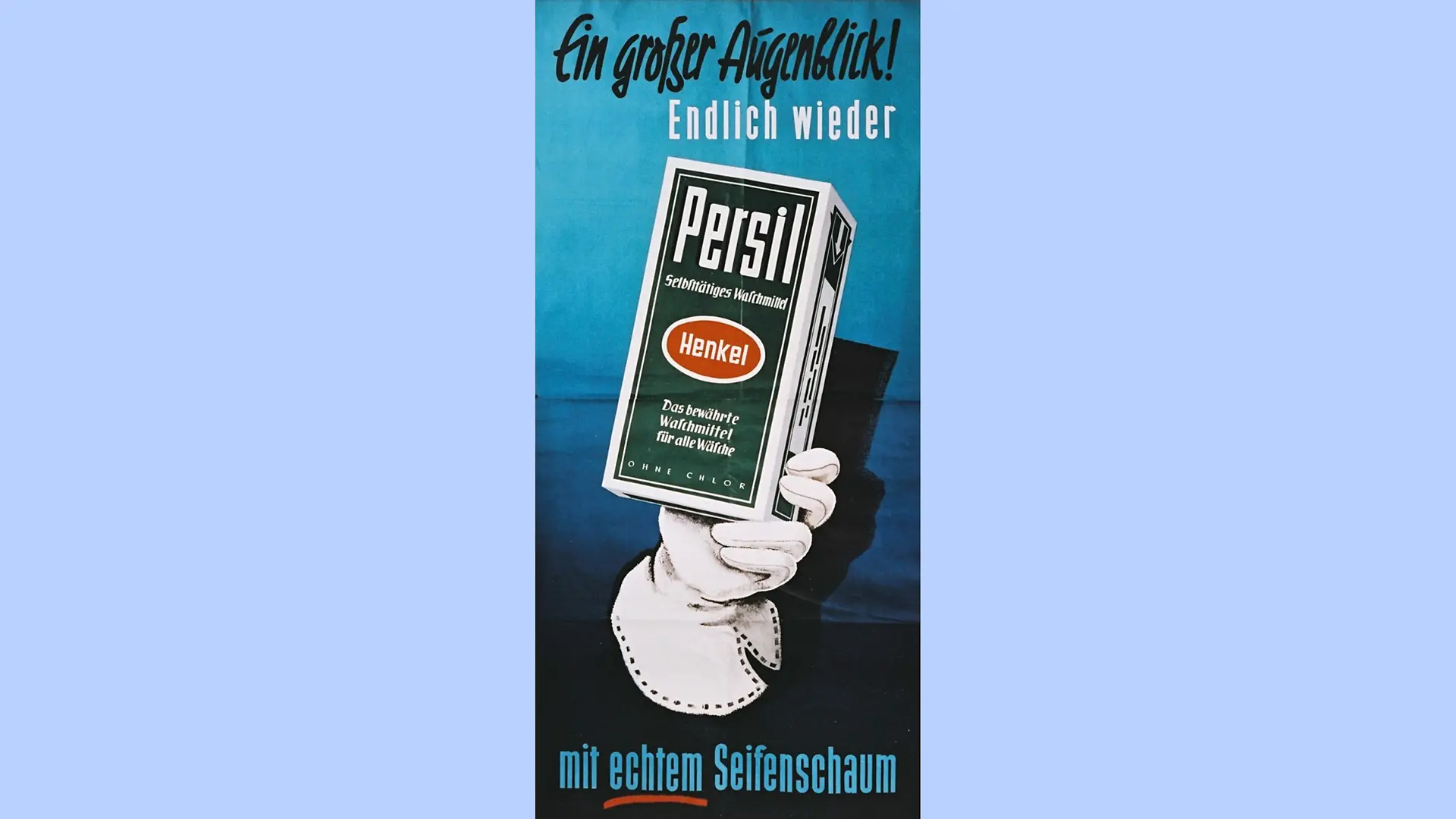 A gloved hand holds a package of Persil. The phrase “Ein großer Augenblick! Endlich wieder” (“A great moment! Finally back”) appear at the top of the poster. At the bottom of the image, it reads “mit echtem Seifenschaum” (“with real soapsuds”).