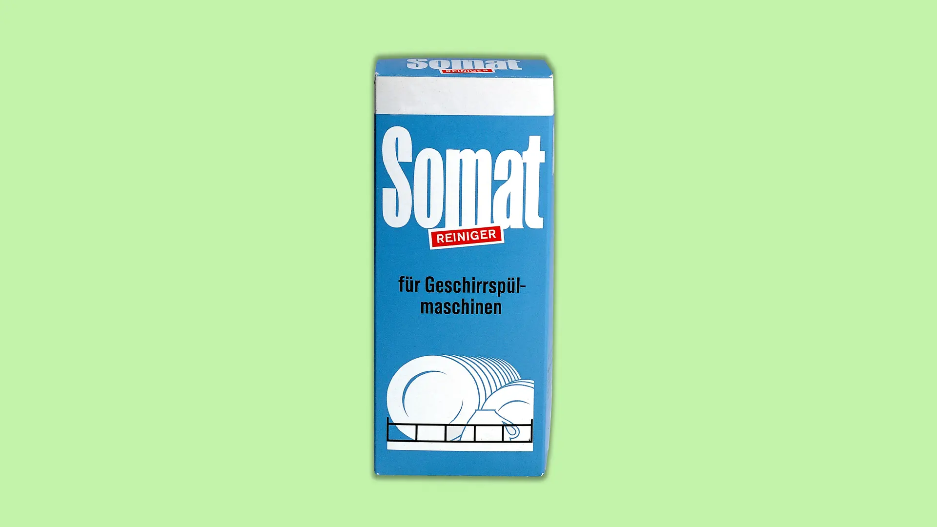 The first Somat from 1962, at that time still in powder form. The packaging is a medium blue color. The brand name Somat can be read in large white letters in the upper half. In the middle underneath, still touching the brand name, is the addition “Cleaner” in a red box with white lettering. Below this ensemble is the additional information “for dishwashers”. Finally, at the bottom of the packaging is an illustration of clean dishes in a dishwasher basket.