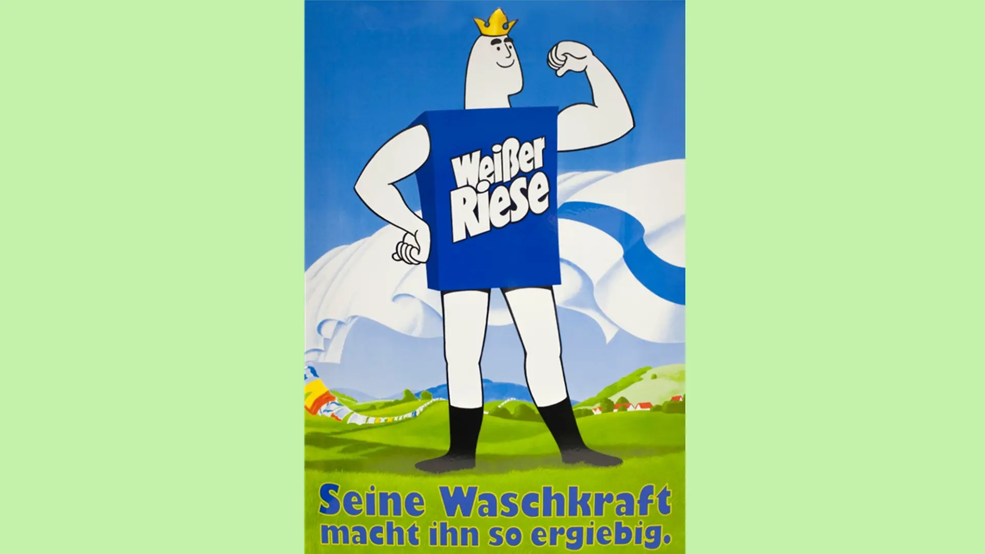 The White Giant – a human-like figure with a dark blue body that imitates a detergent carton and bears the inscription “White Giant”, muscular arms and legs and an oval-shaped head with a prominent chin on which sits a golden crown – stands on a meadow, his gaze turned to the side and his biceps tensed. In the background, fresh laundry is blowing on a washing line. Below him is the slogan “His washing power is what makes him so productive”.