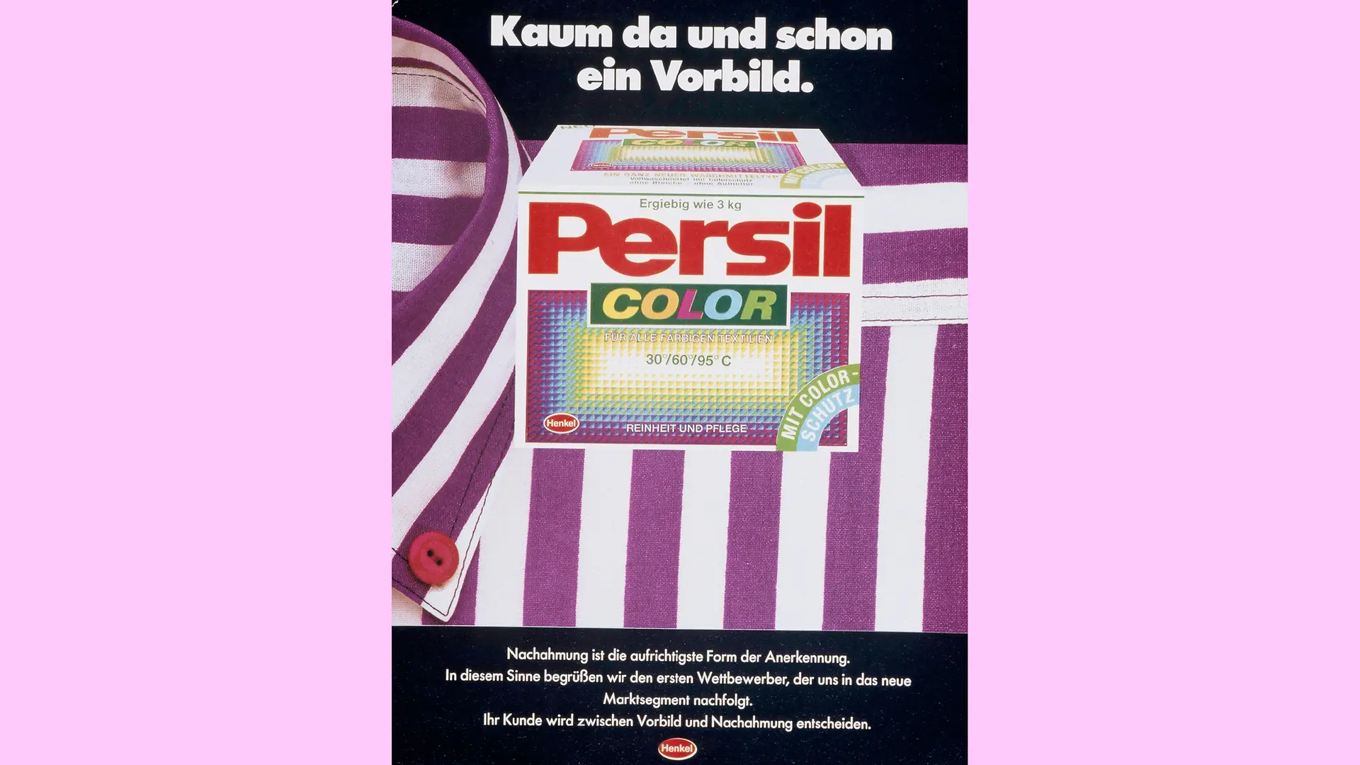 A pack of Persil Color lies on a purple and white striped shirt. The top of the advertisement reads: “Barely there and already a role model”.