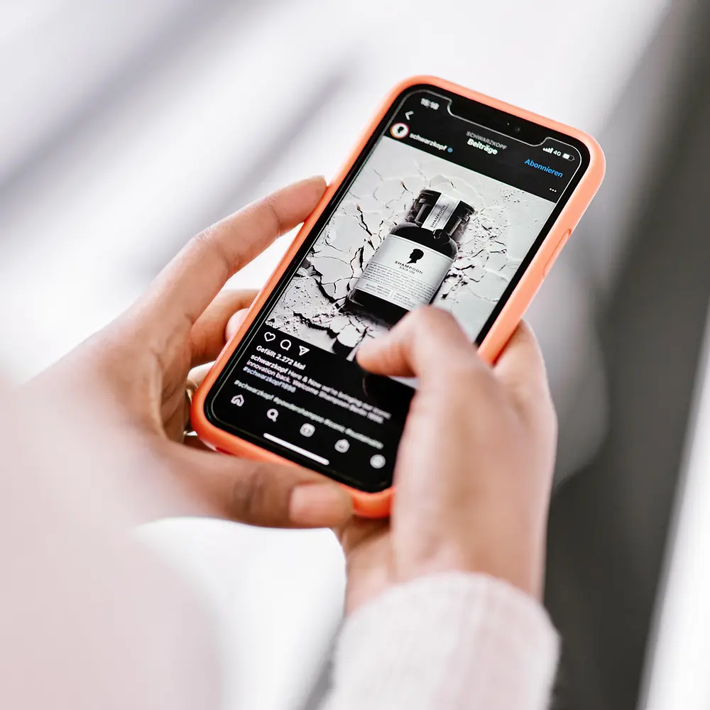 A photo crop of a hand holding a smartphone.