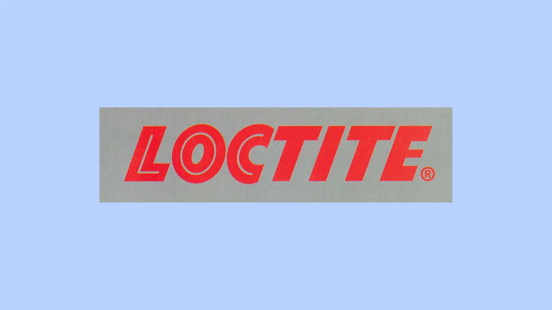 灰色背景上的紅色樂泰（Loctite）標識。 