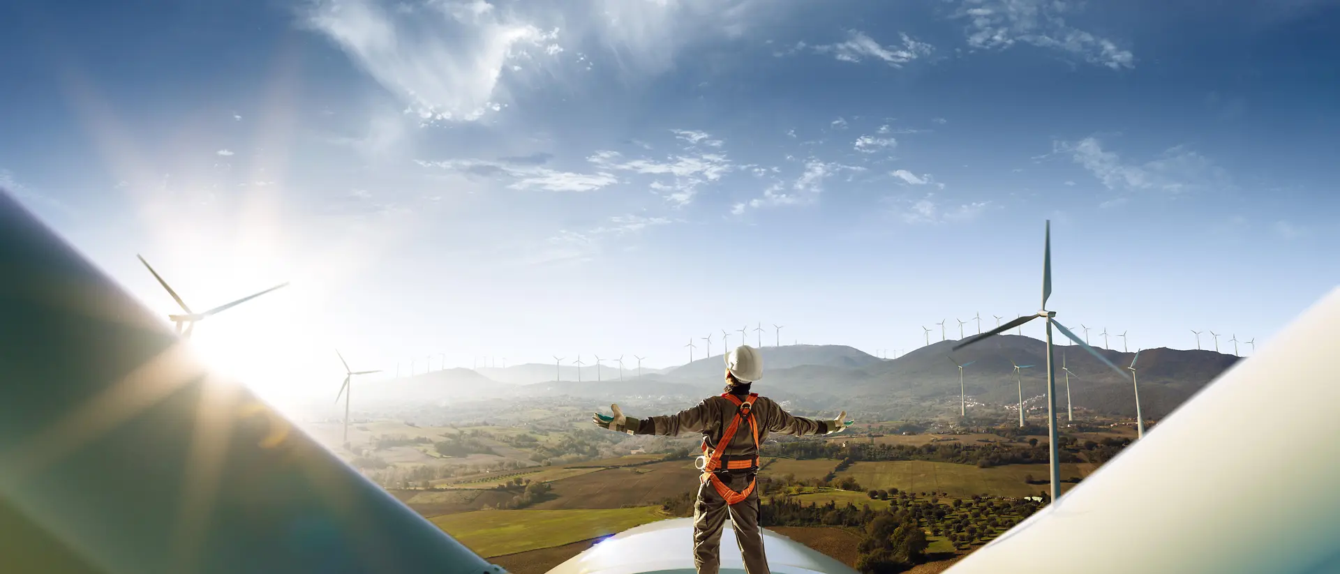 Technician standing on a wind turbine