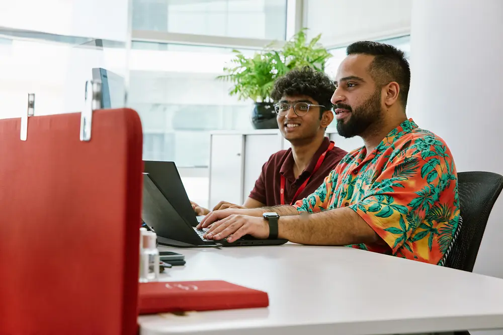 Digital specialists co-creating future-ready solutions in a Henkel tech hub.