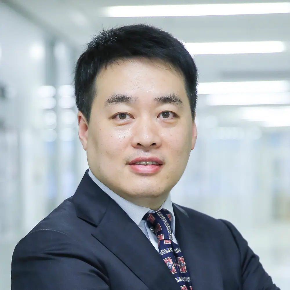 A portrait photo of Wilson Zhang, Head of Innovation Infrastructure Asia-Pacific at Henkel.