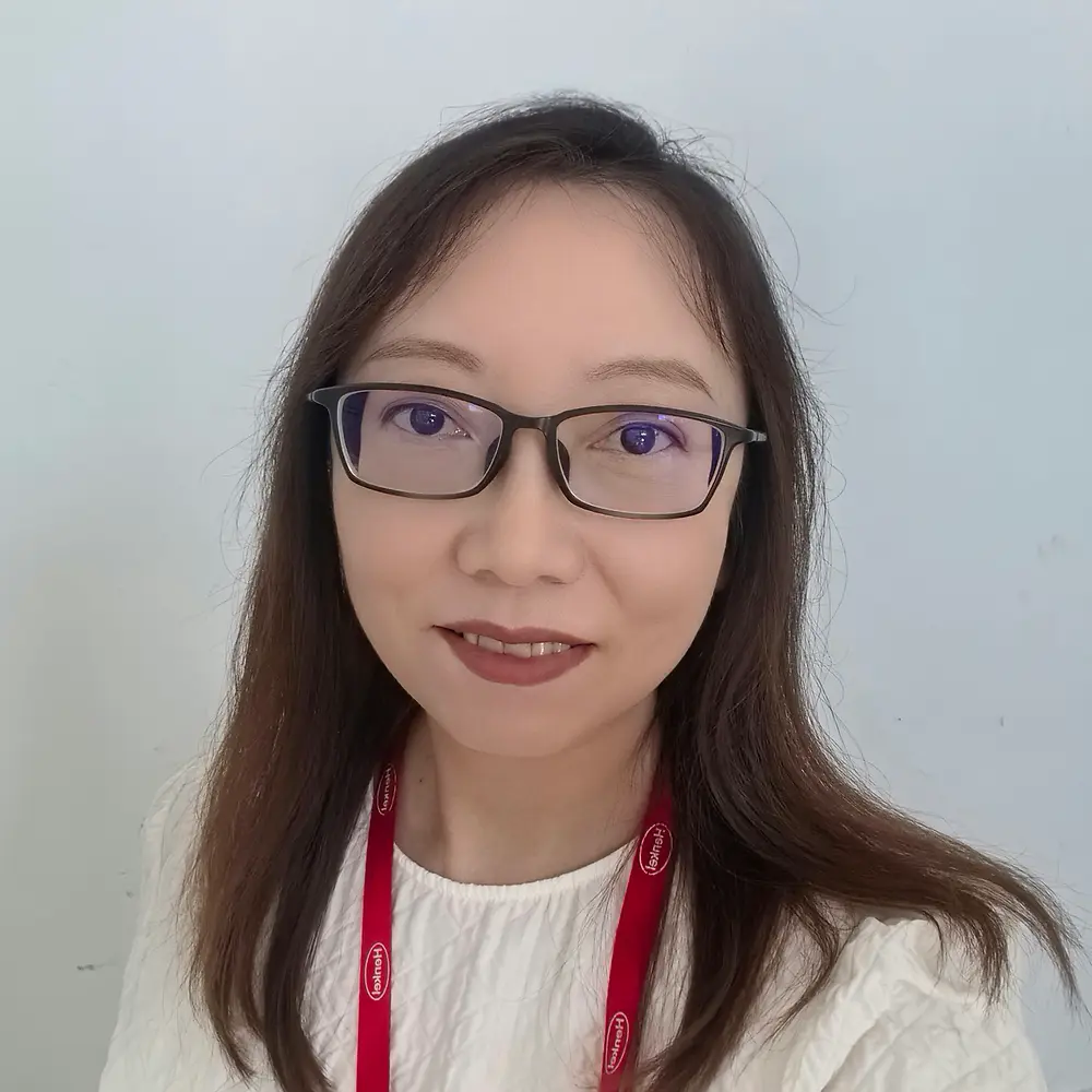 A portrait photo of Xinn Wang, Product Development Manager in the area of metal sealants at Henkel.