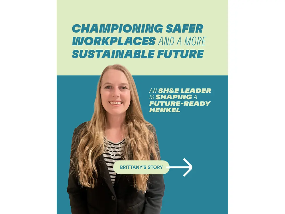 Blonde person in business attire standing in front of graphic about safer workplaces and sustainability.