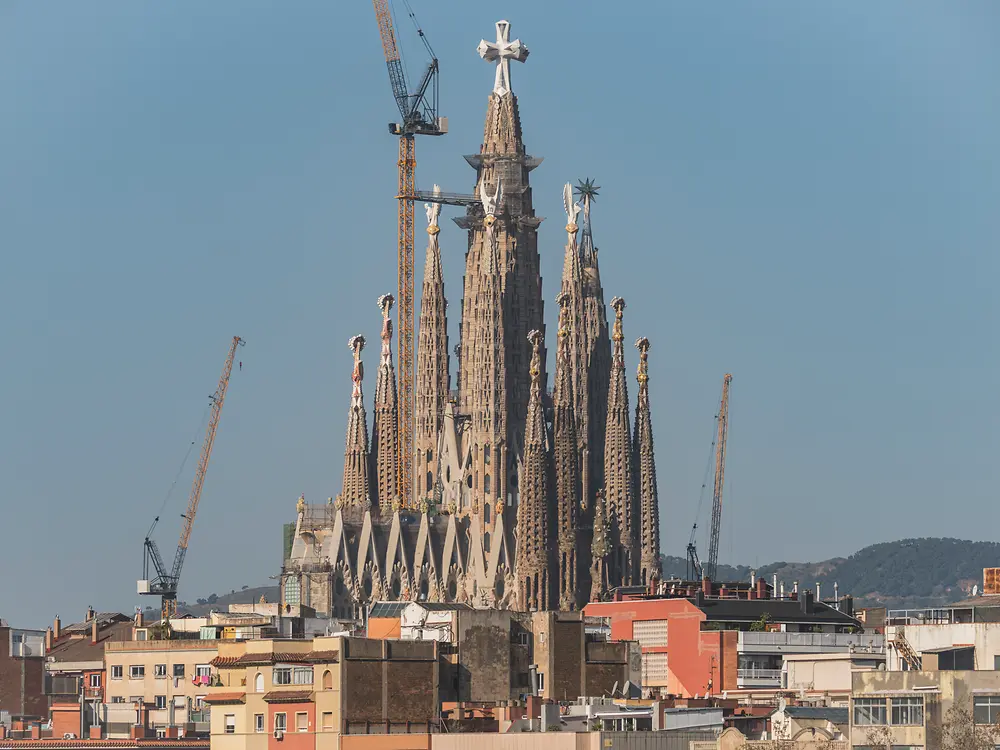 Construction progress of the central towers with cranes and scaffolding in operation