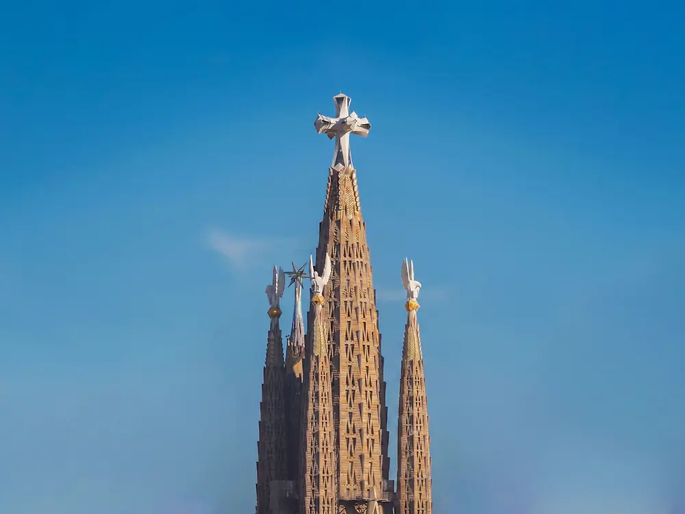 View of the central towers of the Sagrada Familia crowned by the cross