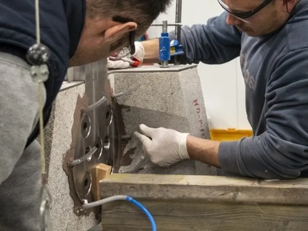Manual alignment of stone and steel elements prior to adhesive bonding
