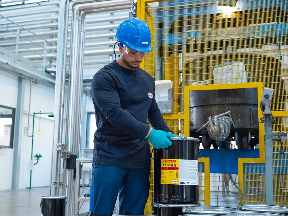 Casarile Plant - Man positioning a bucket of LOCTITE EA 9497