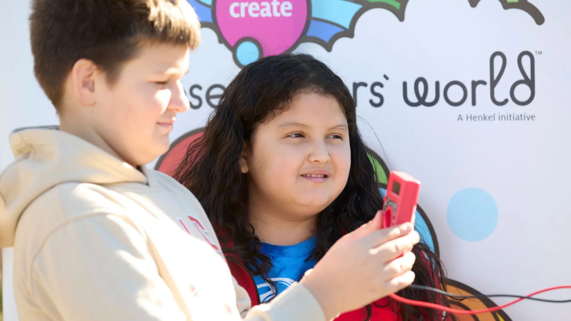 Two children take part in a scientific experiment.