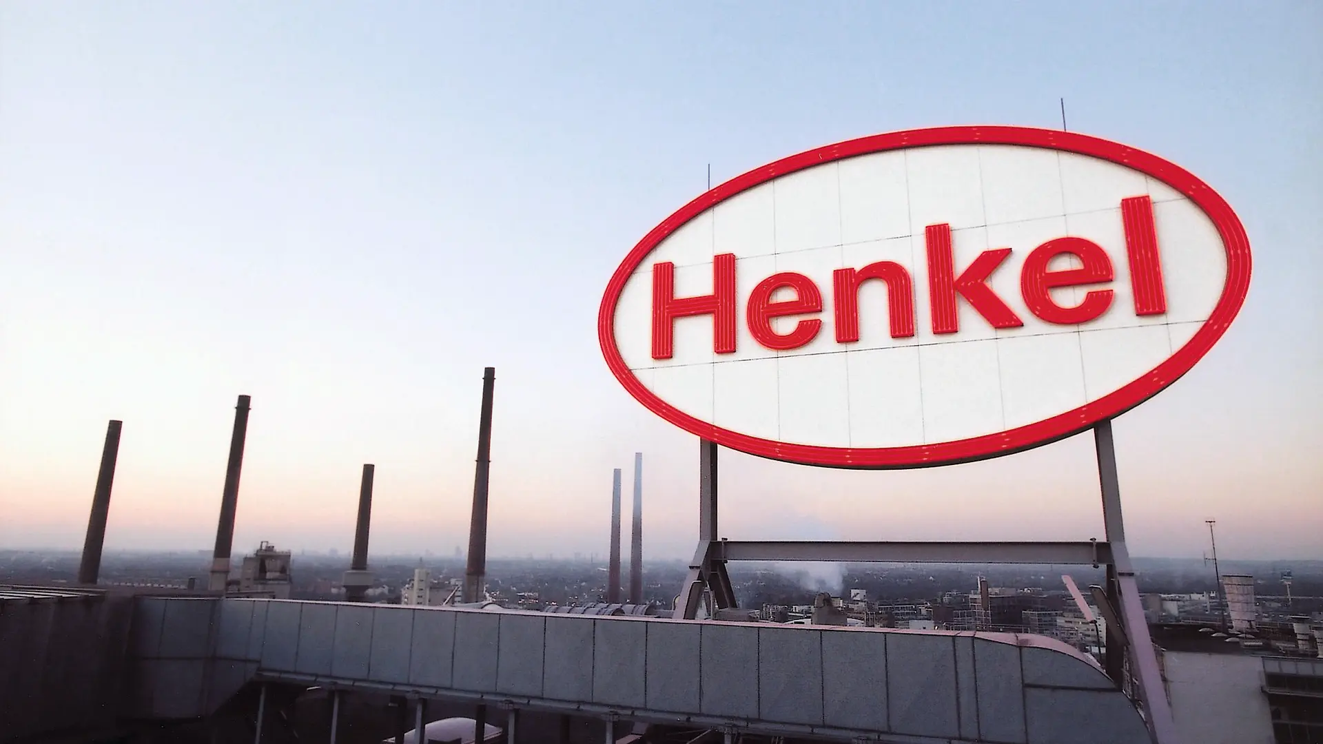 Henkel logo mounted on a rooftop overlooking the Henkel site.