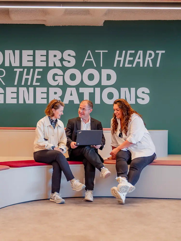 Modern lounge with employees in conversation at Henkel.