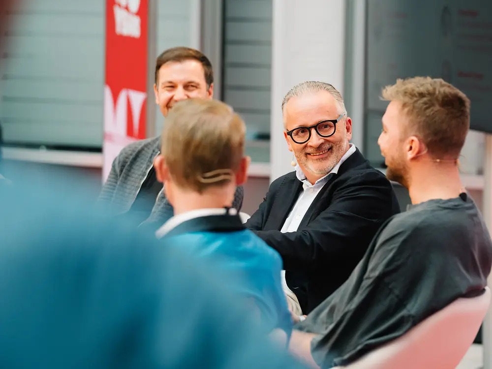 
Carsten Knobel, Chief Executive Officer of Henkel, in conversation with table tennis legend Timo Boll and FIFA World Cup winner Christoph Kramer and Henkel employee Thomas Renger at the Henkel Festival.