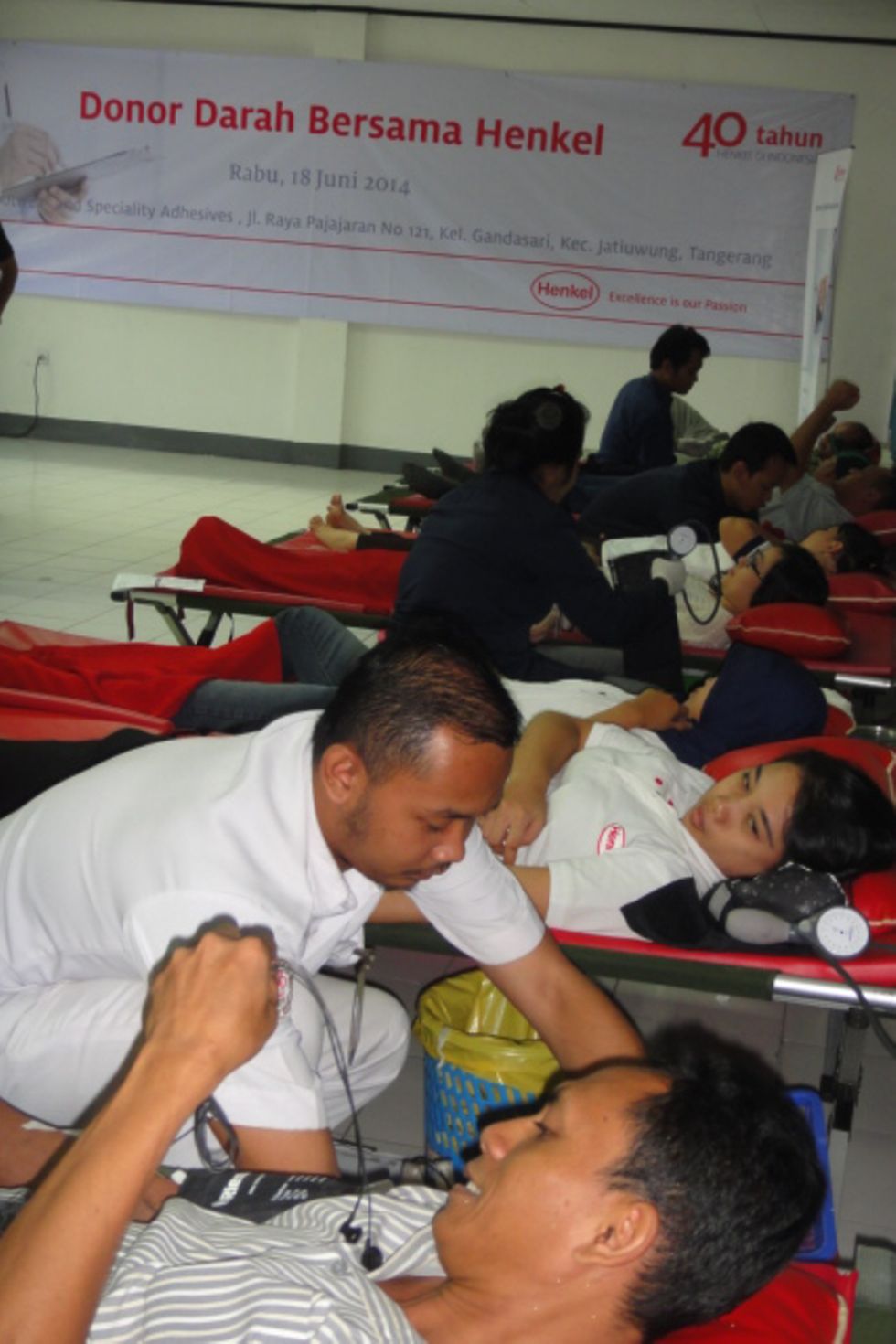 Indonesian employees line up to donate their blood