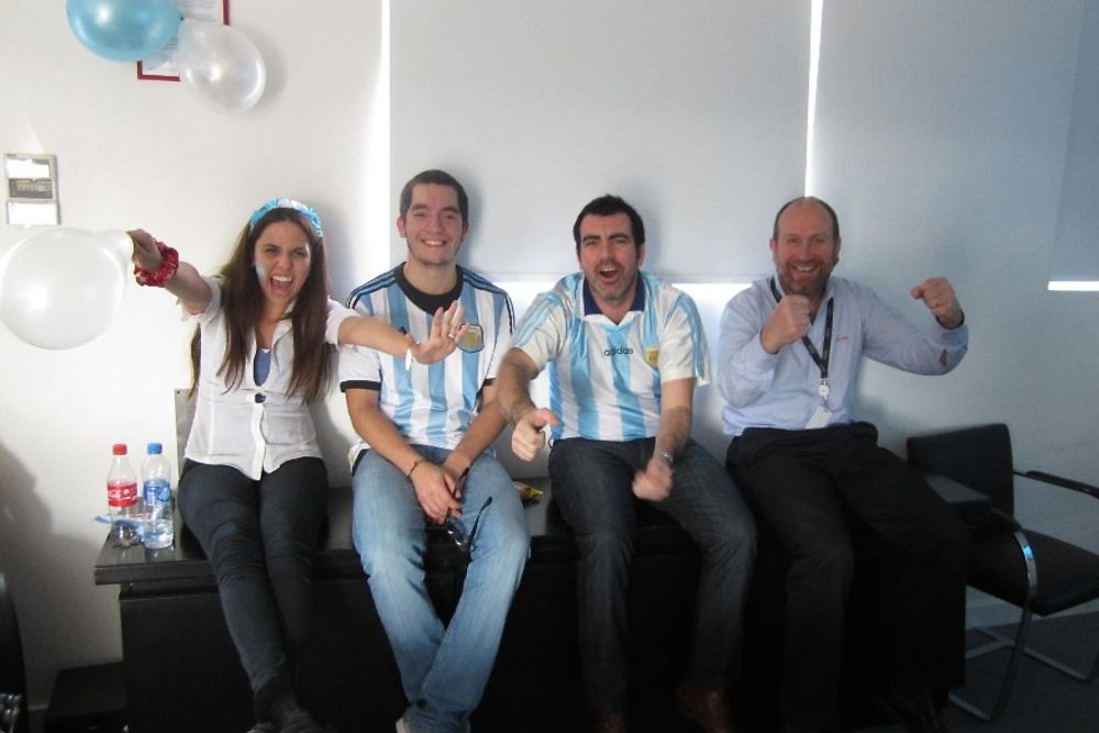 Employees of Henkel Argentina cheering for their favourite team
