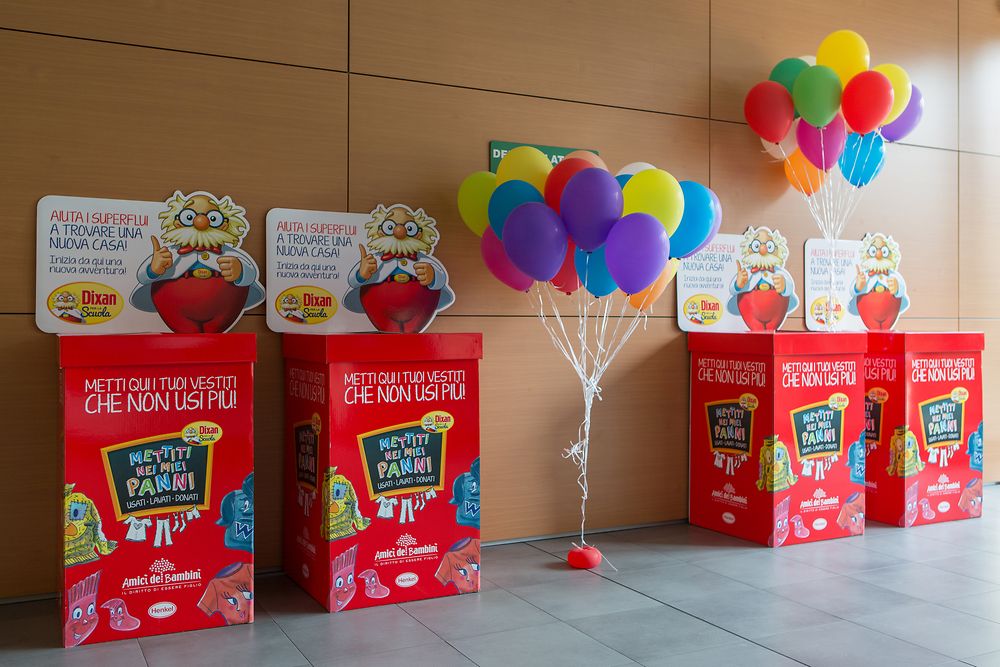 The bright red donation boxes at Henkel’s offices in Milan