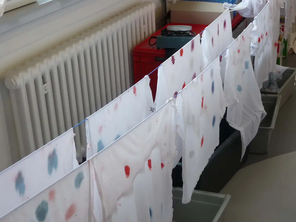 Stained cloth rags drying on the line