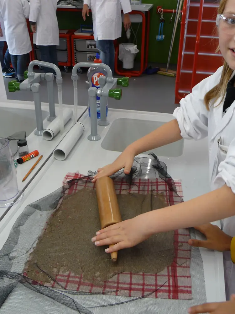 Roll rolling pin over screen
