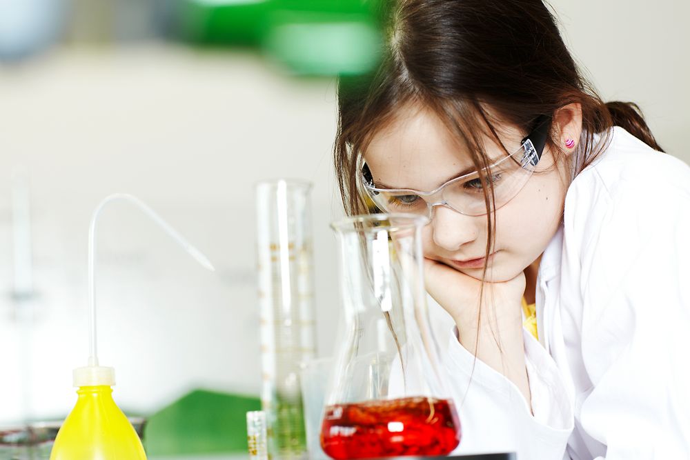 Girl observing an experiment