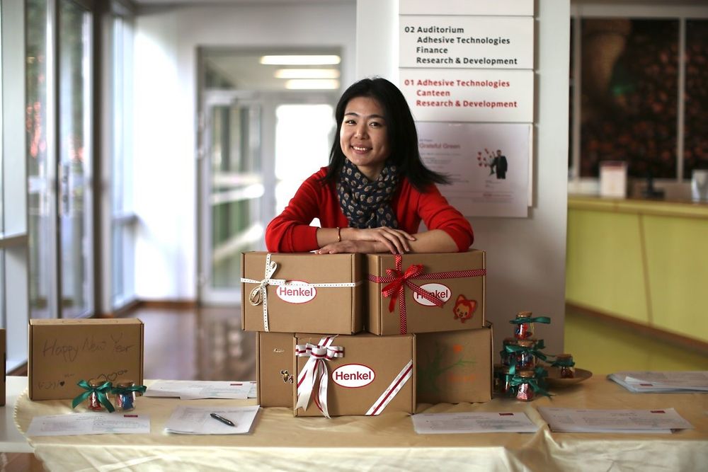 Lucy Zhang, a Grateful Green co-founder, with packed “Boxes of Love” ready to be sent to children in need all over China for the Chinese New Year.