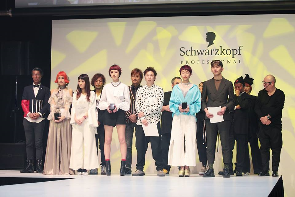 The winners and their hair models on stage