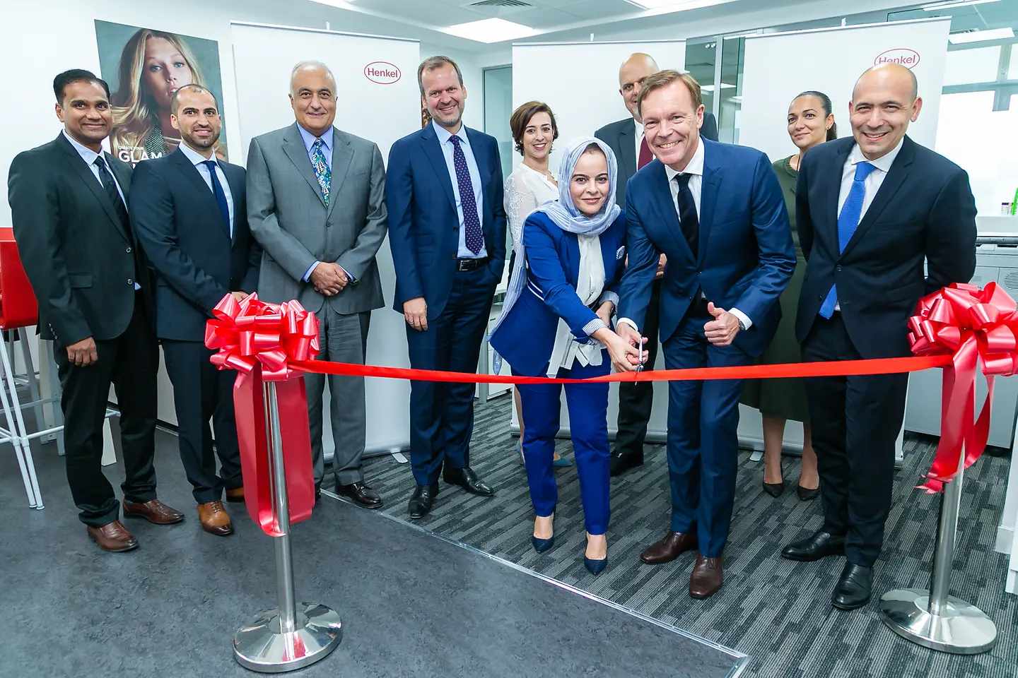 Jens-Martin Schwärzler, Executive Vice President Beauty Care (third from right) and Olfa Aouida, Head of R&D MEA, Beauty Care (sixth from left) during the ribbon cutting.