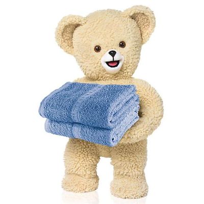 The Snuggle® Bear, a teddy bear holding two folded towels